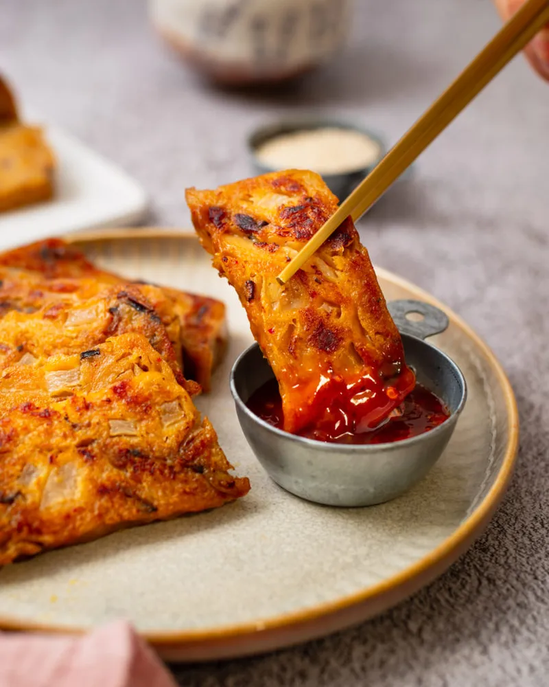 Crispy pan-fried vegan kimchi turnip cakes on a plate