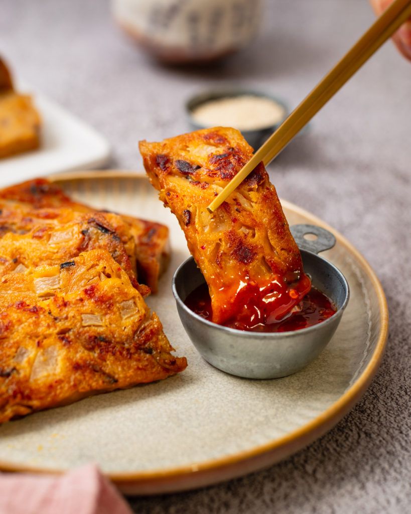 Crispy pan-fried vegan kimchi turnip cakes on a plate