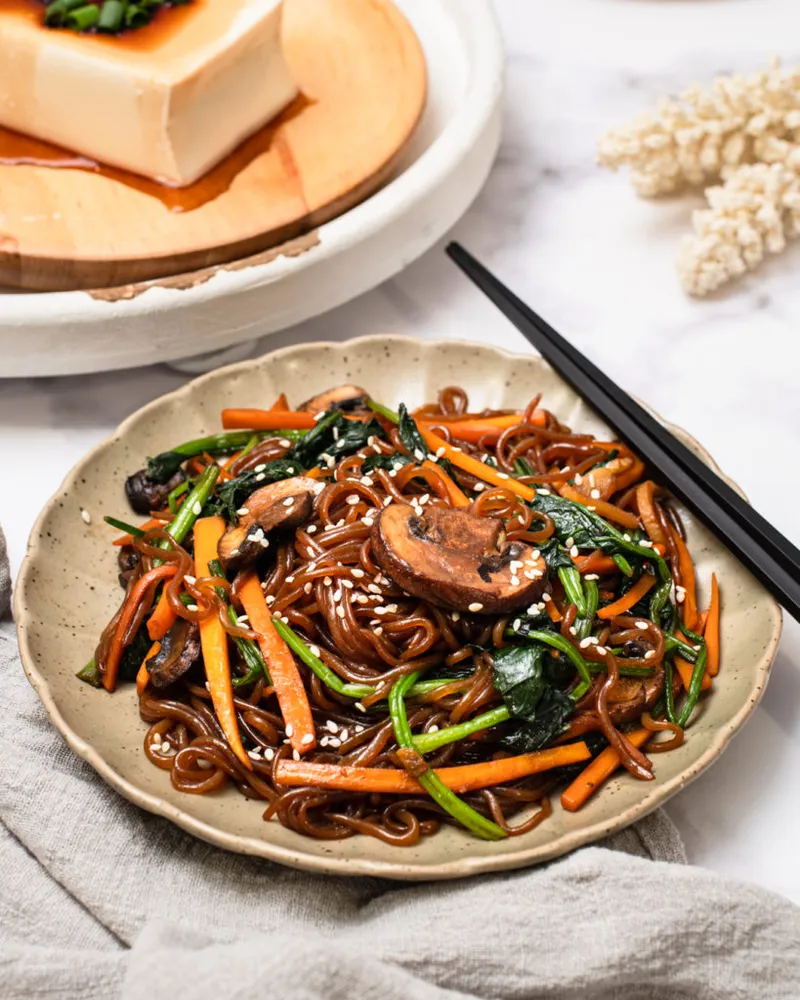 Veggie shirataki noodle stir-fry japchae style with colorful vegetables