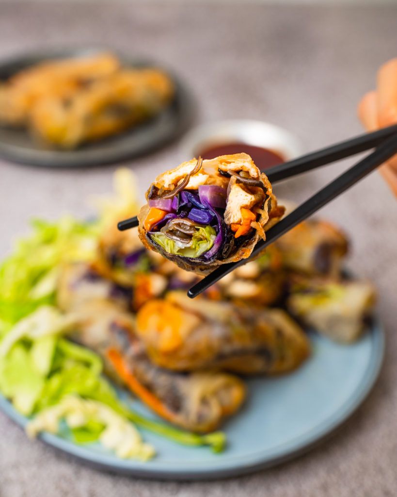 Crispy gluten-free rice paper spring rolls cut in half