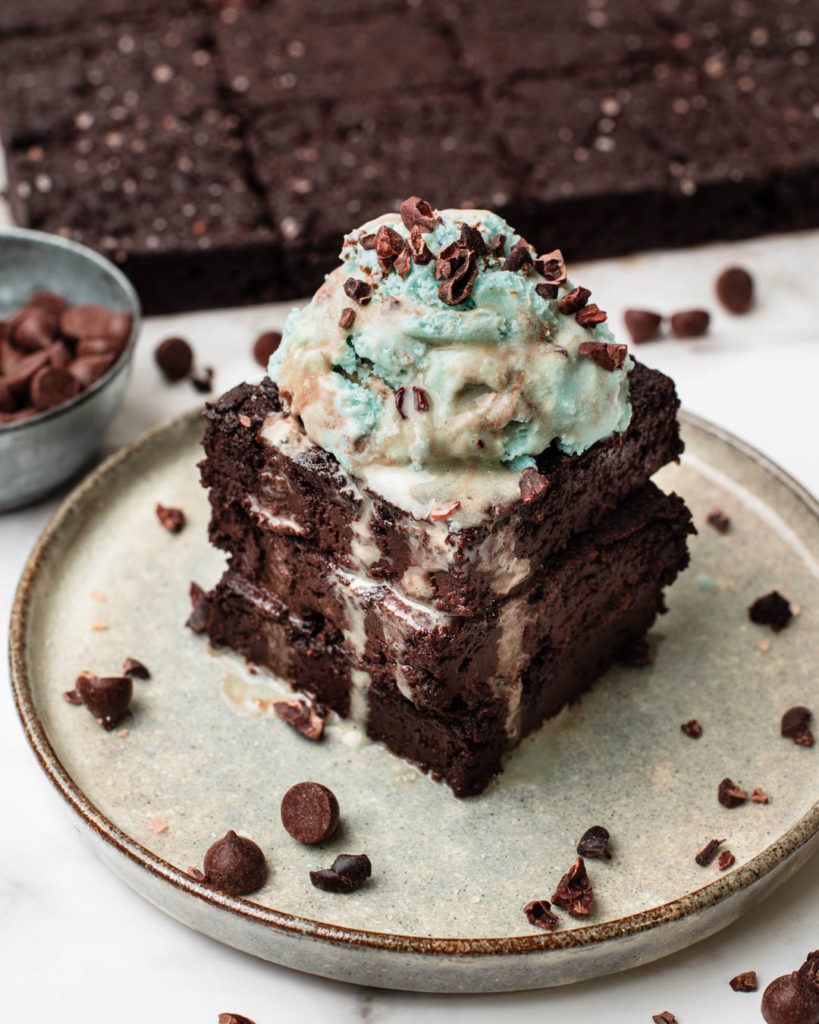 Fudgy vegan keto brownies topped with sea salt flakes and cacao nibs